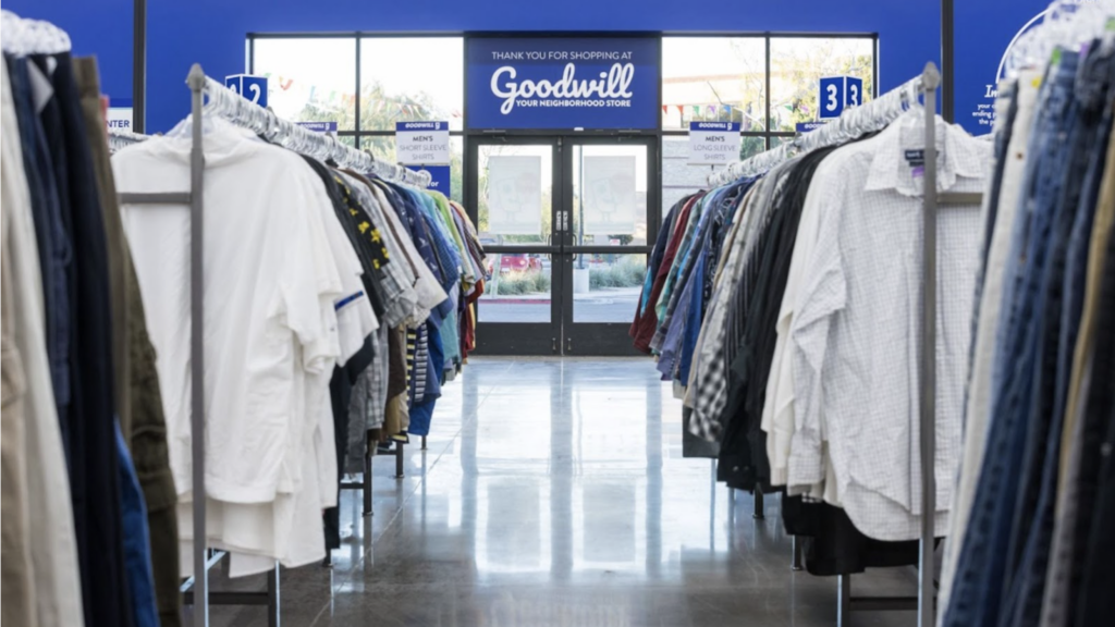 Inside a thrift store with clothing on hangers
